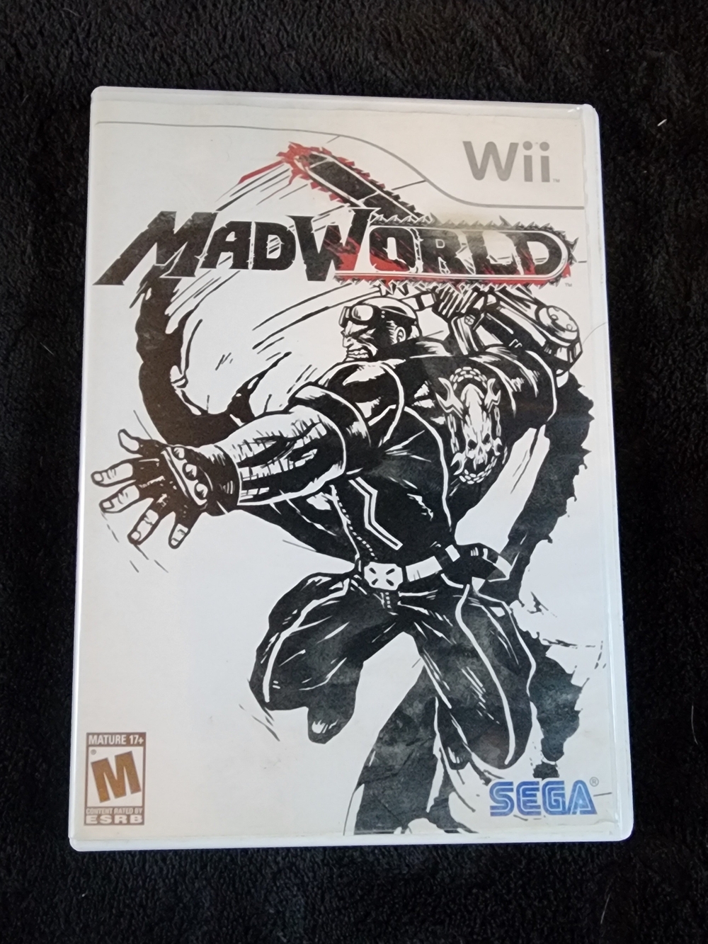 2009 action-adventure game MadWorld for the Nintendo Wii with case and booklet